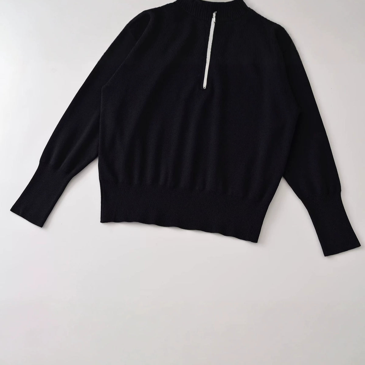 Loose contrasting color trimmed stand up collar knitted sweater for women