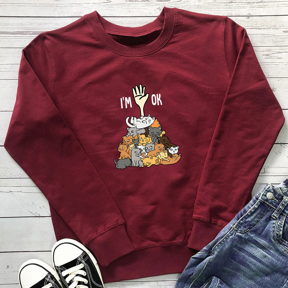 A pile of cat letter printed hoodies